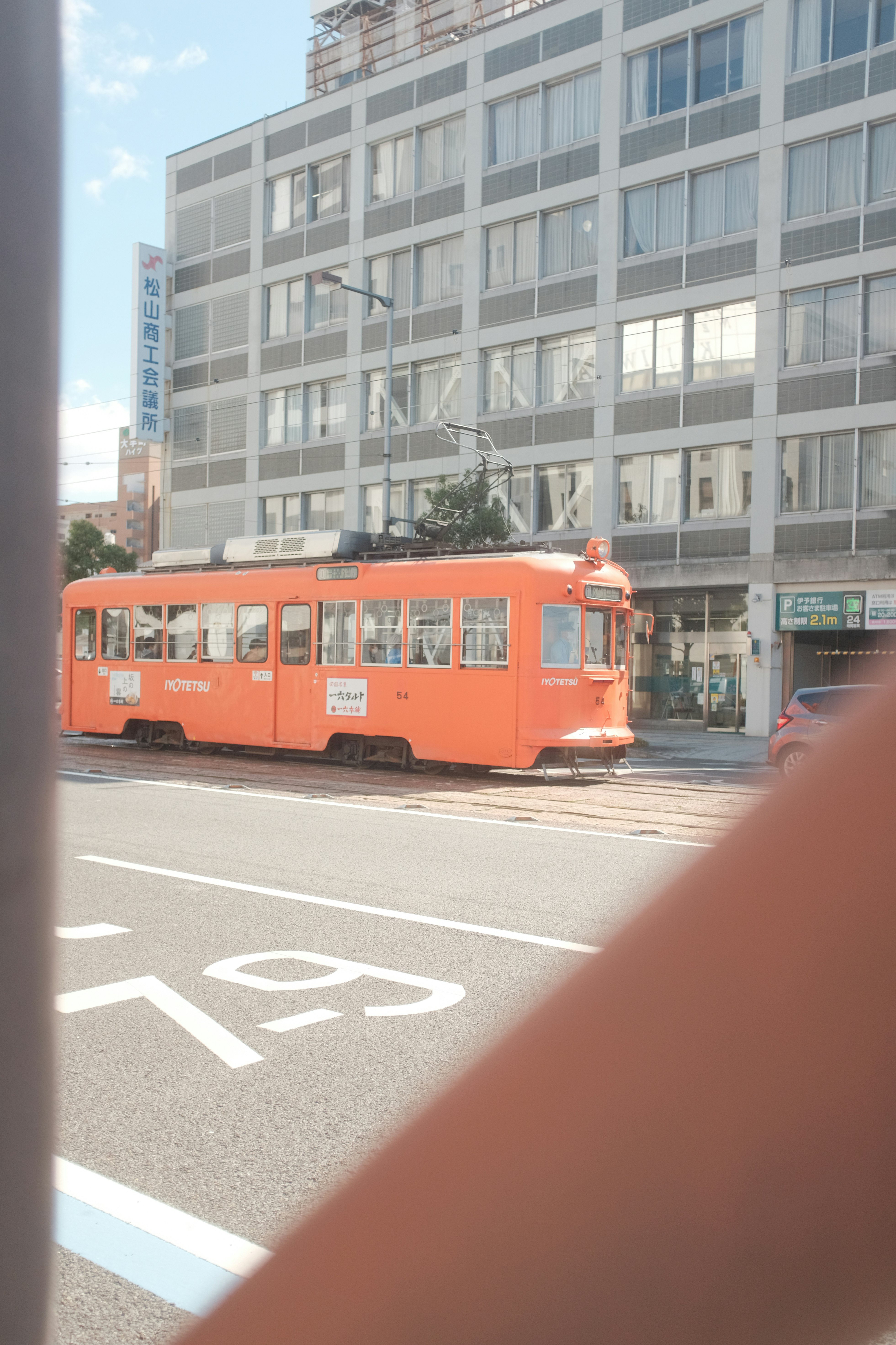 red and yellow tram on road during daytime